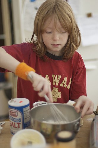 Young girl learning how to make dog treats