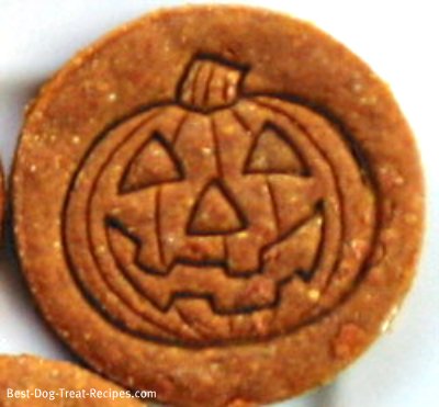 picture of a Halloween peanut butter dog treat with a jack o lantern face